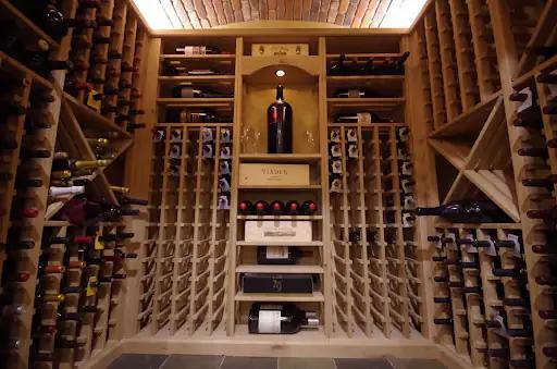 Wooden cellar with various wines stored